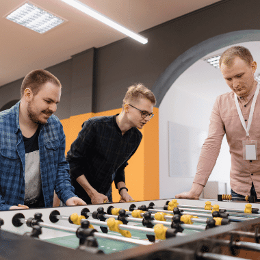 young-office-workers-playing-table-soccer-ZQ9VELY.png